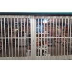 Overhead Door Corporation - Side Folding Full Enclosure Security Grilles 677